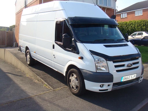 Van Man Oxford - Ford Transit van parked on a residential drive with a house as the backdrop.